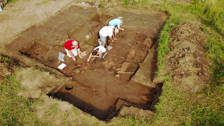 UM undergraduate student Ben Davis, American University graduate student Erin Cagney and UM undergrads Conor Foxworth and Emily Warner excavate the burned wall of structure that dates back to the 1300s at the Carter Robinson site in Virginia. Photo by J.C. Burns